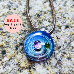 Handmade Starry Sky Glass Necklace,Space Cosmos,Birthday Handmade gifta gift for astronomy enthusiasts and space lovers ✨Our store offers the following discounts -🎈Buy 1 get 40% OFF -🧨Buy 2 get 1 free 📏Pendant size Length: 2.7cm Width: 2.2cm Height: 1.7mm [Material] Glass, New Zealand Opal Made of high-quality glass material, after grinding and polishing, the surface of the pendant is as smooth as a mirror, reflecting a charming brilliance. The pendant encapsulates a miniature galaxy, complete with rotating stars and vibrant nebulae. The detailed cosmic pattern creates a mesmerizing effect, capturing the essence of the universe. Whether you are looking for a birthday gift, anniversary gift or a unique thank you gift, these cosmic glass pendants are an ideal choice. They make a thoughtfu Space-themed Pendant Jewelry Gift, Galaxy Pendant Necklace, Cosmic Necklace, Nebula Necklace, Artistic Glass Necklace With Round Pendant, Handmade Birthday Gifts, Ball Pendant, Glass Necklace, Glass Material