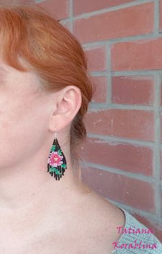 These handmade unique earrings with abstract floral print are made of high-quality Czech beads and strong synthetic thread. I use my author's scheme . They are elegant, fashionable, and highly versatile, suitable for everyday wear. Color: black,pink,red,yellow, green. 100% hand made with love! Copy without my permission is prohibited For those who want to buy my copyright scheme for these earrings: https://www.etsy.com/uk/listing/816043233/brick-stitch-pattern-for-seed-bead?ref=shop_home_active_ Unique Pink Beaded Dangle Earrings, Unique Pink Dangle Beaded Earrings, Handmade Pink Dangle Flower Earrings, Handmade Bohemian Pink Flower Earrings, Handmade Pink Bohemian Flower Earrings, Handmade Pink Flower Earrings With Round Beads, Handmade Pink Flower Drop Earrings, Unique Pink Earrings With Colorful Beads, Pink Flower Earrings With Colorful Beads For Summer