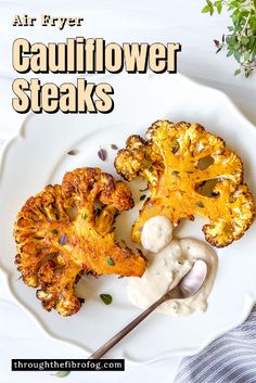 a white plate topped with cauliflower steaks covered in sauce