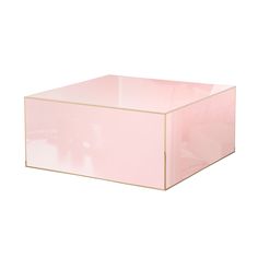 a pink box sitting on top of a white surface