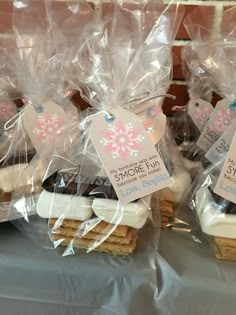 some cookies are wrapped in plastic and sitting on a table