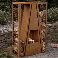 an outdoor fire pit with logs in it