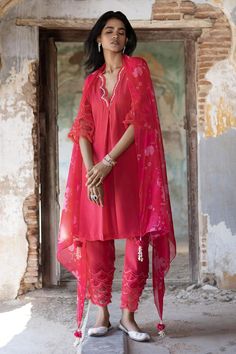 Peony pink kurta with dori, pearl, sequin embroidered neckline and sleeve hem. Paired with flared pant and bagh print dupatta.
Components: 3
Pattern: Printed, Embroidery
Type Of Work: Bagh, dori, pearl, sequin
Neckline: Scallop V neck
Sleeve Type: Three quarter
Fabric: Soft Organza, Net, Crepe
Color: Pink
Other Details: 
Embroidery on pant hem
Sheer printed dupatta
Scallop border
Occasion: Sangeet - Aza Fashions Elegant Pink Dupatta With Gota Work, Designer Festive Pink Sets, Designer Pink Festive Sets, Designer Embroidered Pink Sets, Designer Pink Embroidered Sets, Pink Chikankari Embroidery Dupatta, Elegant Pink Sets With Gota Work, Designer Pink Sets For Festivals, Designer Pink Wedding Sets