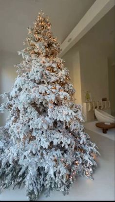 a white christmas tree in a living room