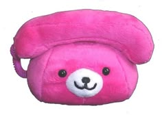 a pink teddy bear purse with a white face on it's head and black eyes