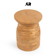 an elephant standing on top of a stack of wooden stools in front of a white background