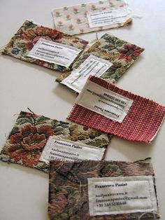 four pieces of fabric with tags attached to them