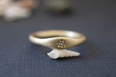 "GOLD DAY =free shipping= Minimalist signet ring for gold lovers. 2mm thick gold ring with a soft oval element set with a beautiful white diamond. This delicate ring is designed to drive attention but without weighing heavily on one. Each piece is finished by hand, distinguishing it from machine-made items. Made with love and care by a jewelry artisan inspired by modern and minimal forms. All my pieces are carefully handmade. Irregularities and imperfection are signs of authenticity. Measures/De Celestial Single Diamond Wedding Jewelry, Celestial Wedding Jewelry With Single Diamond, 14k Gold Celestial Diamond Ring, Celestial 14k Gold Diamond Ring, Celestial Single Diamond Promise Ring, Celestial Style Diamond Ring With Single Round Diamond, Celestial Style Round Diamond Ring With Single Diamond, Celestial Single Diamond Ring Gift, Celestial Style Single Diamond Promise Ring