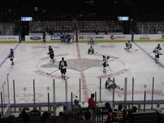 an ice hockey game is being played on the rink