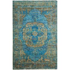 a blue rug with an ornate design on the front and back side, in various colors