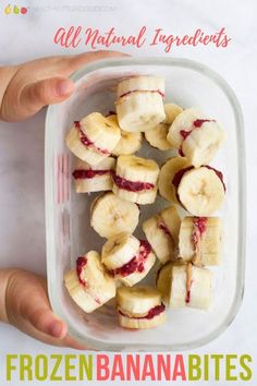 a person holding a plate with sliced bananas and raspberry sauce on it, in front of the words frozen banana bites