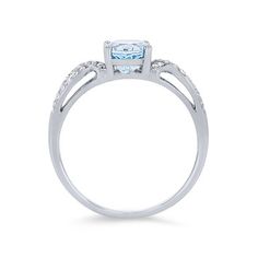 Crafted with romantic twist detail, this ring features a 1.10 carat oval cut aquamarine accented by 0.14 carats of round brilliant cut diamonds. Aquamarine Diamond Ring For Promise, Aquamarine Promise Ring With Diamond Accents, Oval Aquamarine Rings With Diamond Accents, Oval Aquamarine Diamond Ring With Accents, Oval Aquamarine Ring With Diamond Accents, Oval Aquamarine Diamond Ring With Diamond Accents, Oval Blue Topaz Diamond Ring With Accents, Cushion Cut Blue Topaz Rings With Diamond Accents, Light Blue Aquamarine Ring With Diamond Accents