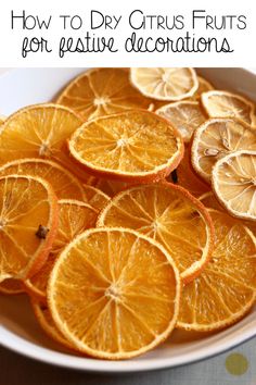 orange slices on a plate with text overlay how to dry citrus fruits for festive decorations