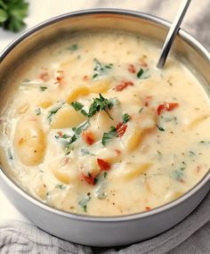 a close up of a bowl of soup on a table