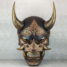 a mask with horns on it is shown