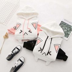 Be the Cat's Meow with Our Adorable Anime Cat Hoodie Meow-wow! Looking for a cute and playful way to show off your love for all things feline? Look no further than our Kawaii Japanese Cat Hoodie! With its sweet cat face on the front and paw prints on the bottom, you'll be the most kawaii kitty in town 🥰 Stay Cozy and Cute All Year Long Our hoodie isn't just stylish - it's practical, too! Made from a premium blend of cotton and polyester, it feels soft and smooth against your skin, making it the White Hooded Kawaii Top, Kawaii Long Sleeve Hoodie With Cat Design, White Kawaii Hoodie With Cartoon Print, White Kawaii Hoodie Top, Cute Long Sleeve Sweatshirt With Cat Design, Cute Cat Print Hooded Hoodie, White Harajuku Hoodie With Cartoon Print, Cute Cotton Sweatshirt With Cat Design, Cute Cat Design Tops For Winter