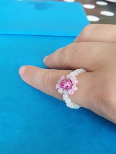 Statement marble pink bead surrounded in a pink flower with a white bead band.  Handmade:) Statement Marble, Marble Pink, Beaded Ring, Pink Beads, Pink Marble, Beaded Rings, White Beads, Pink Flower, Rings Statement