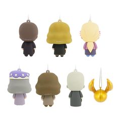 six different types of keychains with small figures on the front and back of them