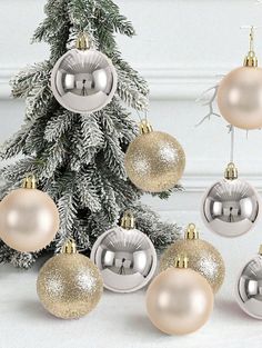 a christmas tree decorated with silver and gold ornaments