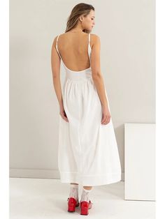 YOU'LL LOOK SWEET AND SULTRY NO MATTER WHERE THE DAY TAKES YOU. IT HAS A MIXED FABRIC CONSTRUCTION WITH A SCOOP NECK, SPAGHETTI SHOULDER STRAPS, A FITTED BODICE AND A GATHERED WAISTLINE THAT DROPS TO A FLOWY SKIRT. TURN AROUND TO SHOW A BACKLESS DESIGN. White Backless Dress For Day Out, White Backless Summer Midi Dress, White Sleeveless Backless Dress For Day Out, White Midi-length Backless Dress With Tie Back, White Midi Length Backless Dress With Tie Back, Unlined Cotton Midi Dress For Vacation, White Backless Sundress For Summer, Low Back Summer Dresses For Brunch, Spring Summer Backless Dress With Low Back