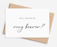 a card with the words will you be my ring bearer? written in cursive ink