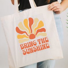 Motivational bag to remind you to bring your own sunshine! A great birthday gift for mom or birthday gift for teenage girl, mother's day gift. This tote has a sunny and summer vibe and is a great accessory for school or to take to the beach! Thank you for choosing to shop on Etsy and finding Lucky Threads Design Co.  Each item in our collection has been designed with care and a touch of fun with the hope of bringing you a touch of luck. We hope you'll find something that resonates with your pers Yellow Canvas Bag As Gift, Fun Rectangular Shoulder Bag Gift, Fun Rectangular Shoulder Bag As Gift, Tote Bag Summer Design, Trendy Summer Canvas Tote Bag, Retro Yellow Bag As Gift, White Rectangular Bags For Birthday Gift, Eco-friendly Letter Print Shoulder Bag Gift, White Rectangular Bag For Birthday Gift