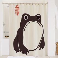 a shower curtain with a frog drawn on it