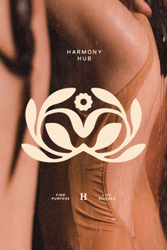 the back of a woman's body with her hands on her hips, in front of an advertisement for harmony hub