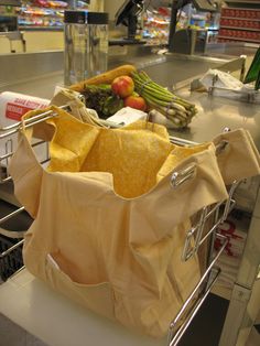 a shopping cart filled with groceries in a grocery store