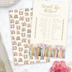 two books are next to each other on a table with pink flowers and an ornate lace doily