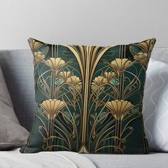 a green and gold art deco design with flowers on it throw pillow, featuring the back side