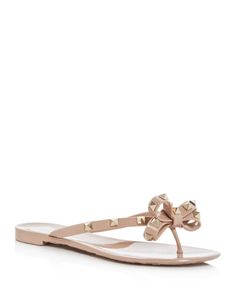 Valentino Garavani Women's Rockstud Bow Flip Flops Valentino Jelly Sandals, White Designer Sandals, Valentino Flip Flops, Luxury Spiked Sandals For Summer, Chic Spiked Sandals For Summer, Designer Spiked Sandals For Summer, Summer Beach Sandals With Gold Studs, Designer Studded Sandals For Summer, Spring Beach Sandals With Gold Studs