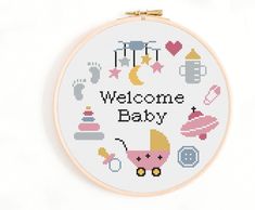 a cross - stitch pattern with the words welcome baby in it's center surrounded by other items