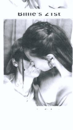 a black and white photo of two women kissing each other with the caption's name on it