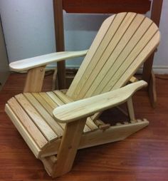 a wooden chair sitting on top of a hard wood floor