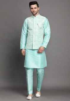 Art Silk Kurta in Sky BlueThis Readymade attire is Enhanced with Buttons, Thread and Sequins Work. Crafted in Chinese Collar Neck and Full SleeveAvailable with an Art Silk Pant in Sky Blue and an Art Silk Nehru Jacket in Sea GreenDo note: Brooch and Footwear shown in the image is for presentation purposes only. Half to one inch may vary in measurement. (Slight variation in actual color vs. image is possible) We sell all kinds of menswear. Mens Kurta | Mens Kurta Pajama | Mens Sherwani | Mens She Traditional Blue Nehru Jacket With Intricate Embroidery, Traditional Blue Nehru Jacket With Chikankari Embroidery, Blue Chikankari Embroidery Sets For Spring, Embroidered Cotton Bandhgala In Blue, Embroidered Blue Cotton Bandhgala, Transitional Blue Sets With Floral Embroidery, Blue Cotton Nehru Jacket With Zari Work, Blue Nehru Jacket With Intricate Embroidery For Festive Occasions, Festive Blue Nehru Jacket With Intricate Embroidery