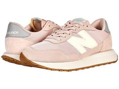 New Balance Classics 237v1 - Women's Shoes : Oyster Pink/Storm Blue : Add the perfect pop of retro to your morning jaunt with the iconic silhouette of the New Balance Classics 237v1 sneakers. Casual shoes with suede and mesh or textile uppers in a sporty silhouette. Foam-padded collar and tongue. Soft linings and a removable foam insole provide all-day comfort. Traditional lace-up closure. TPU heel insert for extra support. ENCAP® midsole for cushioning. Durable rubber outsole. Imported. Measure Sneakers With Boost Midsole For Spring Jogging, Athletic Fit Mesh Sneakers With Round Toe, Spring Nylon Sneakers With Textured Sole, Spring Low-top Athletic Fit Sneakers, Mesh Sneakers With Contrast Sole For Light Sports, Low-top Athletic Sneakers For Spring, Spring Nylon Sneakers With Contrast Sole, Spring Mesh Sneakers For Light Sports, Spring Sneakers For Light Sports, Nylon Material