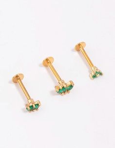 Add interest to your ear stack with our selection of surgical steel flat back piercings. Surgical steel is a durable material that's gentle on sensitive skin and designed for everyday wear. This earring pack contains three, gold plated flat backs — each adorned with emerald-coloured crystals for a pop of colour. Material: Crystal, Gold Plated, Surgical Steel Dimensions: Post Length 8mm x Feature Length 5mm Gauge: 16G / 1.2mm Suitable for these piercing placements: Cartilage, Lobe, Conch | Lovisa Earring Pack, Back Piercings, Ear Stack, Color Crystal, Conch, Sensitive Skin, Piercings, Color Pop, Everyday Wear