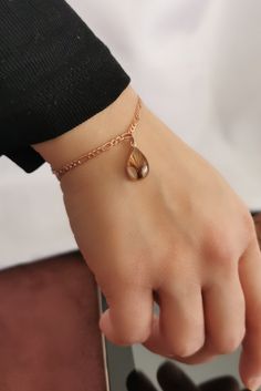 "✓ Personalized Minimal Keepsake Bracelet For Women, Our Solid 925 Sterling Silver Bracelet with %100 hand crafted, gold workmanship is specially produced for you, Jewelry made with love for your special occasions. ---● B R A C E L E T ∙ D E T A I L S ●--- * The Chain and Case Of The Hair Is SOLID 925 STERLING SILVER. * The Top Of The Hair is made of UV stable resin. And your hair will be safe in it. * Current production time is 4 to 8 business days from the moment we receive your sample of hair Handmade Teardrop Bracelets As Gift, Hypoallergenic Adjustable Drop Jewelry, Adjustable Teardrop Bracelet For Gifts, Handmade Brown Charm Bracelet Gift, Hypoallergenic Teardrop Crown Jewelry Gift, Hair Locket, Bridesmaid Bracelet Gift, Hair Keepsake, Hair Bracelet