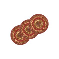 three circular rugs with red and yellow designs