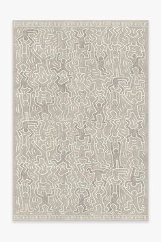 a beige and white rug with an abstract design