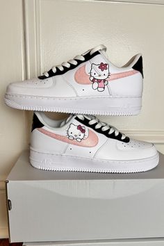 Custom sneakers featuring glittery pink Swooshes and adorable Hello Kitty accents. #HelloKitty #GlitterSwooshes