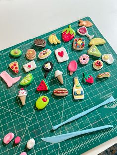 a cutting board topped with lots of different types of cookies and pastries on top of it