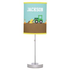 a lamp shade with a tractor on it and the name jackson printed on it