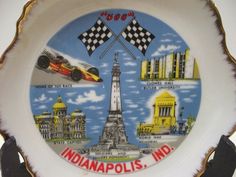 a plate with the words indianapolis, md and images of race cars on it is shown