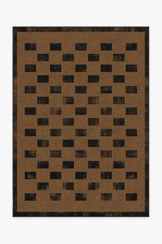 a brown rug with black squares on it