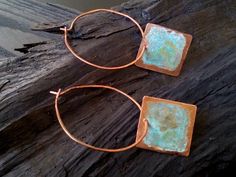 Rustic square charms dance about antiqued copper hoops. I hammered copper wire for strength and gave to the square charm a rustic Patina finish. The hoops can be dangle if i add hooks. You can send me a notice if you want to be with hooks. All my jewelry coated with protective wax finish to prevent tarnish. Available in 3 size: Medium hoops 1.5 inches / 4cm, Large hoops 2 inches / 5cm and X Large hoops 2.5 inches / 6cm *Shades of the patina vary due to the organic chemistry of the patina process Small Bohemian Copper Hoop Earrings, Bohemian Small Hoop Copper Earrings, Bohemian Small Copper Hoop Earrings, Hand Forged Copper Hoop Earrings With Dangle, Hand Forged Copper Dangle Hoop Earrings, Forged Jewelry, Copper Wire Earrings, Cold Connections, Precious Metal Clay Jewelry