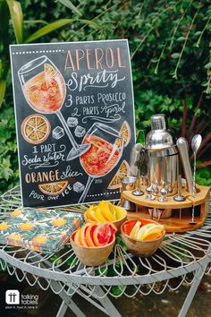 a sign that says apricot sprits on it next to bowls of fruit