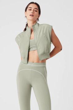 In Motion Vest - Limestone | Alo Yoga Sporty Spring Outerwear Vest, Sporty Sleeveless Alo Yoga Tank Top, Alo Yoga Sporty Sleeveless Tank Top, Sporty Tank Vest For Streetwear, Sleeveless Alo Yoga Athleisure Top, Alo Yoga Sleeveless Athleisure Top, Alo Yoga Sporty Sleeveless Top, Sporty Sleeveless Vest For Spring, Sporty Sleeveless Vest Outerwear