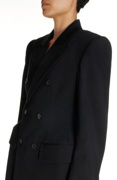 Demna revisits the iconic hourglass shape with this wool-gabardine blazer channeling the exaggerated tailoring of master courtier Cristóbal Balenciaga. Double-breasted button closure Peaked lapels Four-button cuffs Chest welt pocket; front flap pockets 100% wool Dry clean Made in Italy Designer Clothing Wool Tuxedo Blazer With Double-breasted Fastening, Wool Tuxedo Blazer With Double-breasted Button, Black Double Breasted Suit For Evening, Black Double Breasted Suit With Double Button For Evening, Luxury Black Blazer Dress For Business, Luxury Black Blazer Dress With Double-breasted Button, Black Double-breasted Evening Suit, Luxury Black Blazer Dress With Double Button, Luxury Black Blazer Dress With Double Button Closure